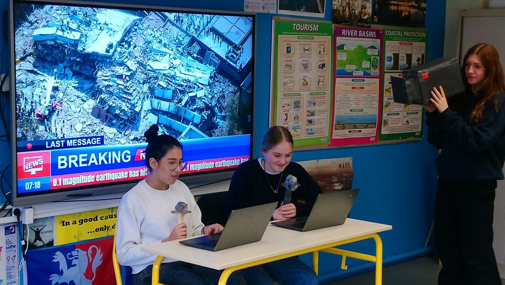 Students in Jason's class practice roleplaying the news
